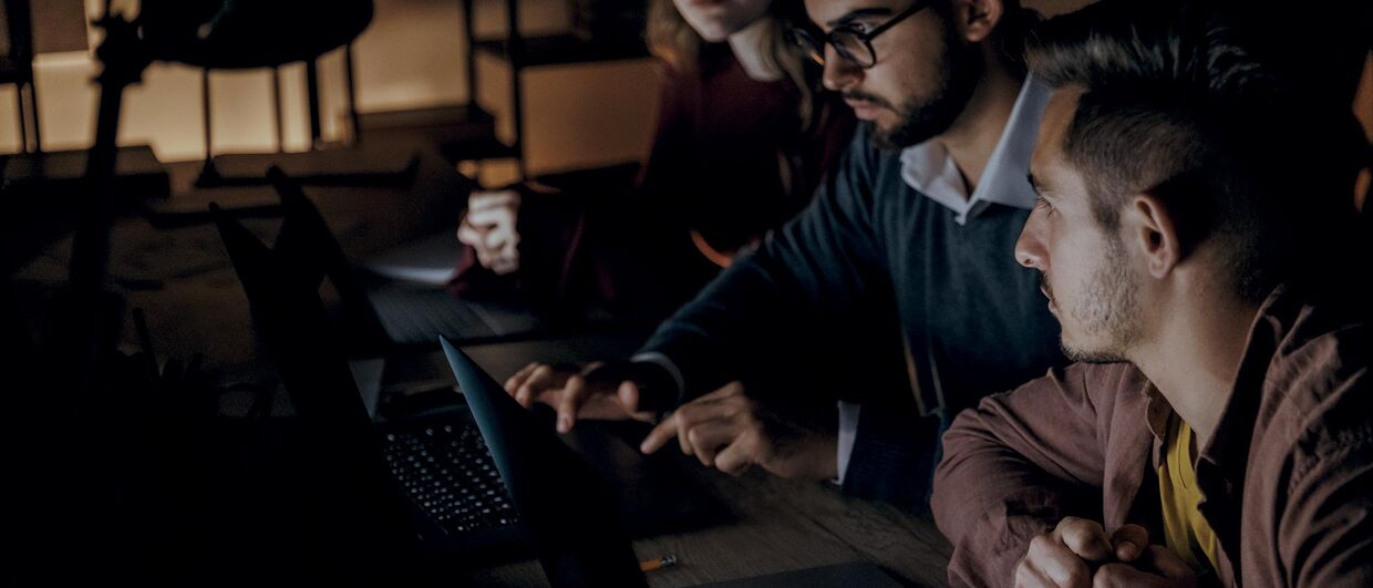 Working together at a laptop in the office